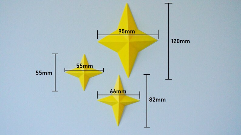 May include: Three yellow paper stars of different sizes. The largest star measures 95 mm wide and 120 mm tall. The middle star measures 66 mm wide and 82 mm tall. The smallest star measures 55 mm wide and 55 mm tall.