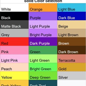 Op de afbeelding: Een tabel met een selectie van effen kleuren, waaronder wit, zwart, oranje, paars, lichtblauw, donkerblauw, beige, lichtbruin, bruin, donkerbruin, terracotta, goud, zilver en meer.