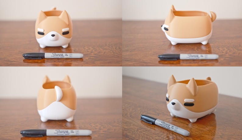 May include: A brown and white ceramic planter shaped like a dog. The planter has a small opening on the top for planting. The planter is sitting on a wooden surface.