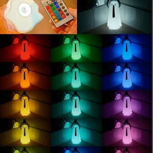 Peut inclure: Une veilleuse en forme de fant&ocirc;me blanc avec une t&eacute;l&eacute;commande offrant plusieurs options de couleurs. La lumi&egrave;re est pr&eacute;sent&eacute;e dans diff&eacute;rentes couleurs, notamment le rouge, l'orange, le jaune, le vert, le bleu, le violet et le blanc.