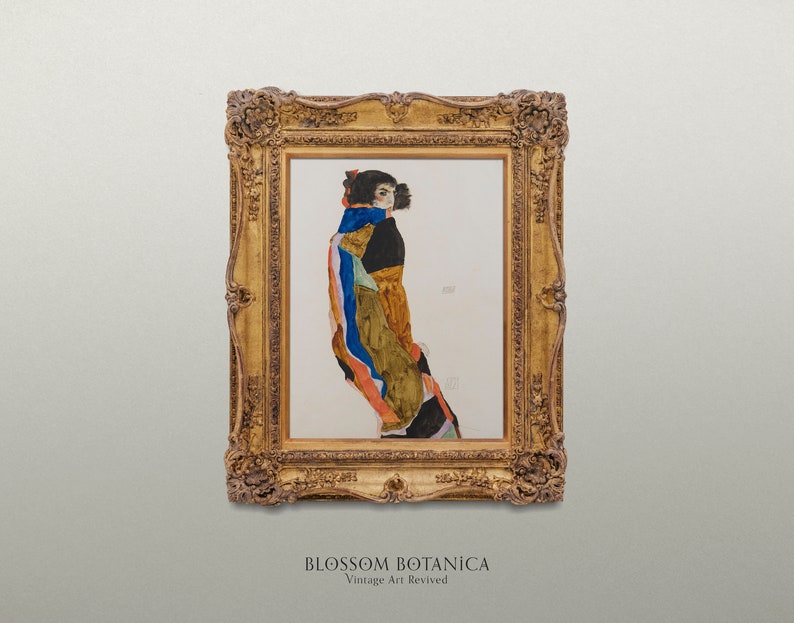 May include: A framed painting of a woman in a colorful, abstract dress. The painting is in a gold frame with ornate details. The title "BLOSSOM BOTANICA Vintage Art Revived" is printed below the frame.
