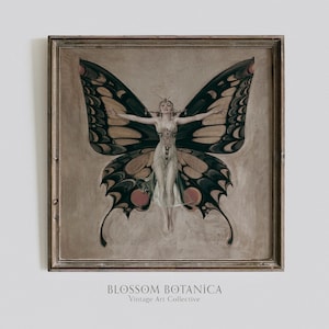 May include: A framed vintage art print featuring a woman with butterfly wings. The wings are black, yellow, and red with intricate patterns. The woman is wearing a white dress and has her arms outstretched. The print is titled "BLOSSOM BOTANICA Vintage Art Collective".