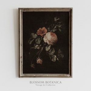 May include: A framed vintage botanical print featuring a bouquet of pink and red roses with green leaves and a butterfly on a dark background. The frame is a light wood color.