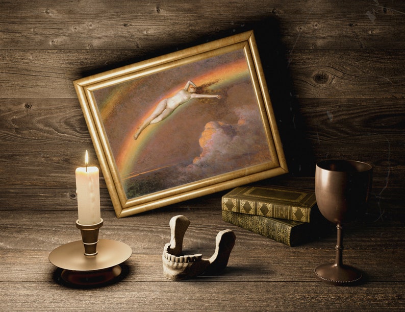 May include: A framed painting of a woman flying through the air above a rainbow, a lit candle in a candlestick, a skull, and a goblet on a wooden surface.