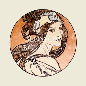May include: A vintage illustration of a woman with long brown hair wearing a patterned headscarf. The illustration is in a circle with a peach background and the text "BLOSSOM BOTANICA" in white.