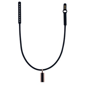 May include: A black necklace with a rose gold and black rectangular pendant. The necklace has a thin, curved black cord and black adjustable straps with small holes and gold-colored buttons.
