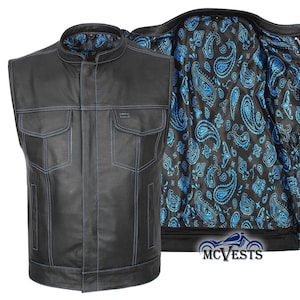 May include: Black leather vest with blue stitching and two front pockets. The interior lining features a blue paisley pattern on a black background. The vest has a mandarin collar and a motorcycle-themed logo.