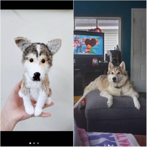 May include: A small, handcrafted crochet dog figurine featuring a mix of white, tan, and dark gray yarn. The plush toy has pointed ears, a white muzzle, a black nose, and dark eyes, designed to resemble a husky-type dog with a seated posture.