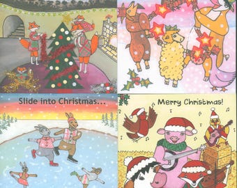 May include: A set of four Christmas greeting cards featuring illustrated animals. Top left: foxes decorating a tree with text Have a TREEmendous Christmas! Top right: animals with crackers and text Have a Cracking Christmas! Bottom left: animals ice skating with text Slide into Christmas... Bottom right: animals playing music with text Merry Christmas!