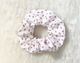 White scrunchie with small red flowers