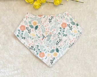 Bandana bib in white cotton with green, yellow and salmon floral patterns