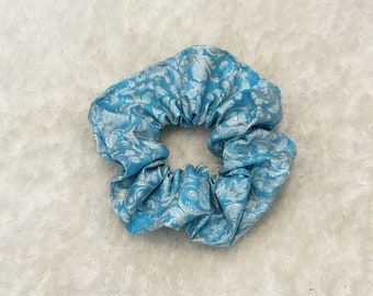 Blue scrunchie with silver glittering paisley patterns