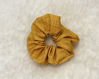 Yellow scrunchie with grid patterns