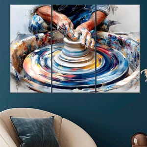 May include: A triptych canvas print depicting a potter at work. The artist's hands, covered in paint, shape a clay pot on a spinning wheel. The artwork features a vibrant palette of blues, yellows, and reds, creating a dynamic and artistic scene.