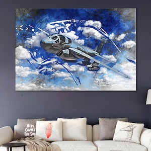 May include: A blue and gray abstract painting of a jet plane flying through the clouds. The plane is in sharp focus, while the clouds and background are blurred.