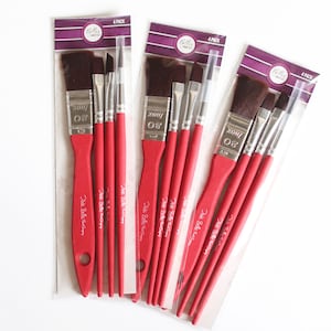 May include: A set of 12 red handled paint brushes with silver metal ferrules and black bristles. The brushes are packaged in three packs of four. Each pack has a label that says "Belles Brushes" and "4 Pack".