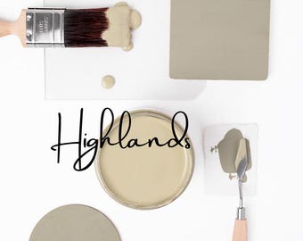 May include: A paint brush with dark bristles covered in light beige paint, a round container of beige paint labelled Highlands, a palette knife with a wooden handle, a square beige paint swatch, and a circular beige paint swatch on a white surface.