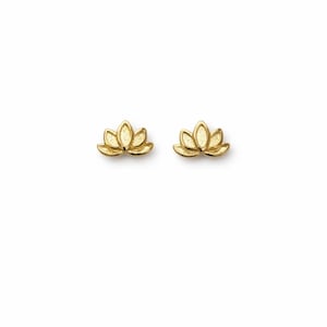 May include: A pair of gold-colored lotus flower stud earrings. Each earring features a detailed, three-dimensional design of the flower's petals. The earrings are presented against a plain white background.