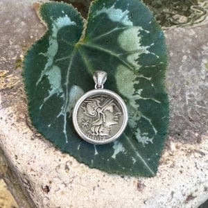 Authentic silver coin (148 BC) depicting the Goddess Rome sterling silver pendant. In the back: Castor e Pollux