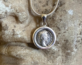 Roman coin (2nd century AD) pendant depicting Emperor Marcus Aurelius; Mars standing on the reverse side