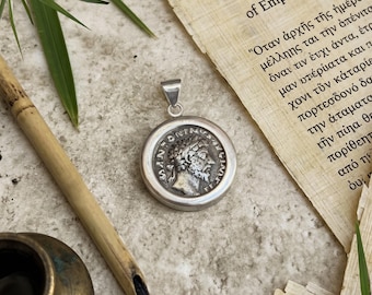 Roman coin (2nd century AD) pendant depicting Emperor Marcus Aurelius; Concordia on rear