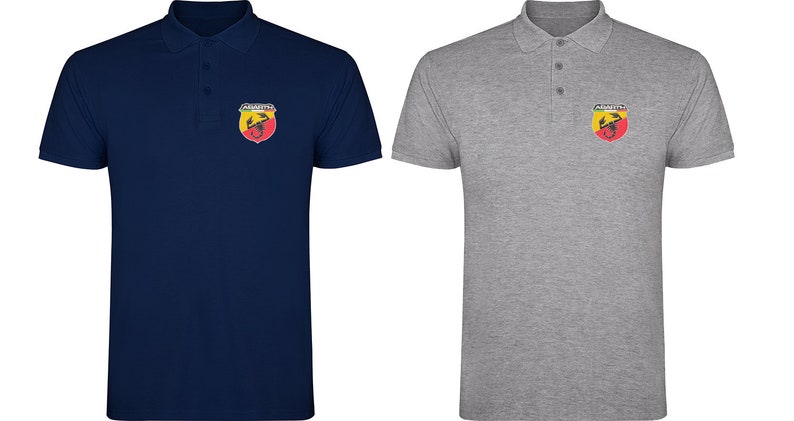 May include: Two polo shirts with a red, yellow, and black scorpion logo on the left chest. The shirt on the left is navy blue and the shirt on the right is gray.