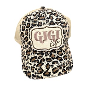 GiGi Life . Embroidered Patch . Criss Cross Ponytail Trucker Hat