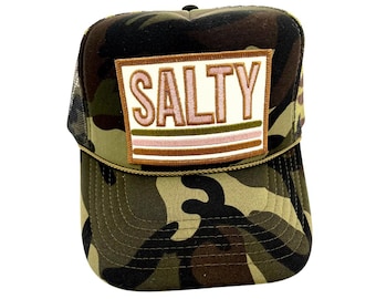 May include: A camouflage trucker hat with a white patch that says "SALTY" in pink and green letters. The patch has brown stripes.
