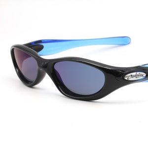 May include: Black Oakley sunglasses with blue arms and blue tinted lenses.