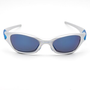 May include: Silver sunglasses with blue accents and blue mirrored lenses.
