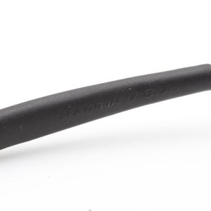 May include: Close-up of a black eyeglass arm with the text "MADE IN U.S.A." embossed on the side. The arm is curved and appears to be made of a matte material.