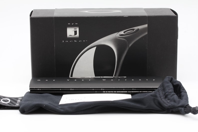 May include: Black box with the text "eye jacket" and a graphic of sunglasses. Includes a black drawstring bag, a warranty card, and a black case. The sunglasses are not visible.