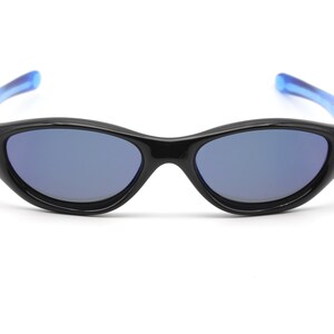 May include: Black sunglasses with blue arms and blue tinted lenses.