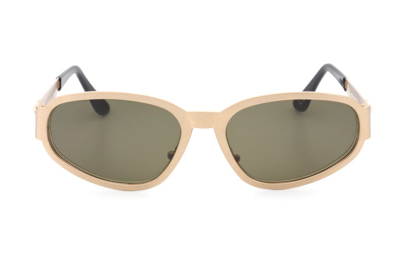 May include: Gold-toned oval sunglasses with dark gray lenses.