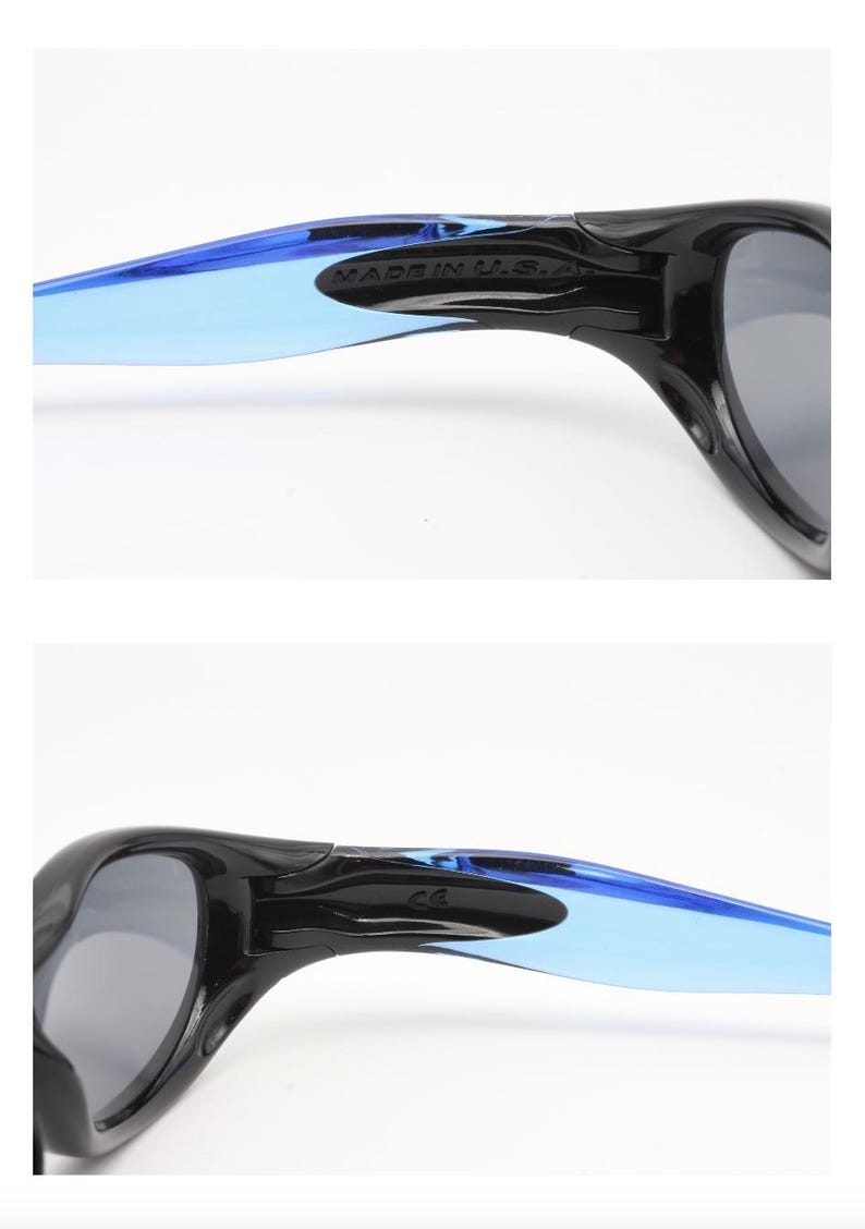 May include: Black sunglasses with blue and gray tinted lenses. The sunglasses have a black frame and blue and gray temples. The text "MADE IN U.S.A." is printed on the temple.