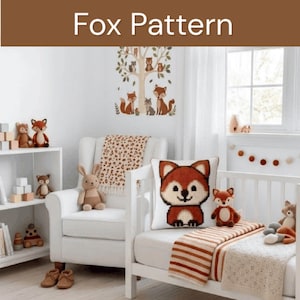 May include: A white square throw pillow featuring a pixelated fox graphic in shades of orange, brown, and white. The pillow is placed on a white crib next to a striped blanket, surrounded by various plush animal toys and a fox-themed wall decal.