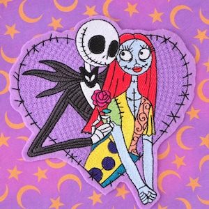 May include: Embroidered patch featuring Jack Skellington and Sally from The Nightmare Before Christmas, set against a purple heart. Jack is in a black suit, Sally in a patchwork dress, holding a rose. The background is purple with moons and stars.