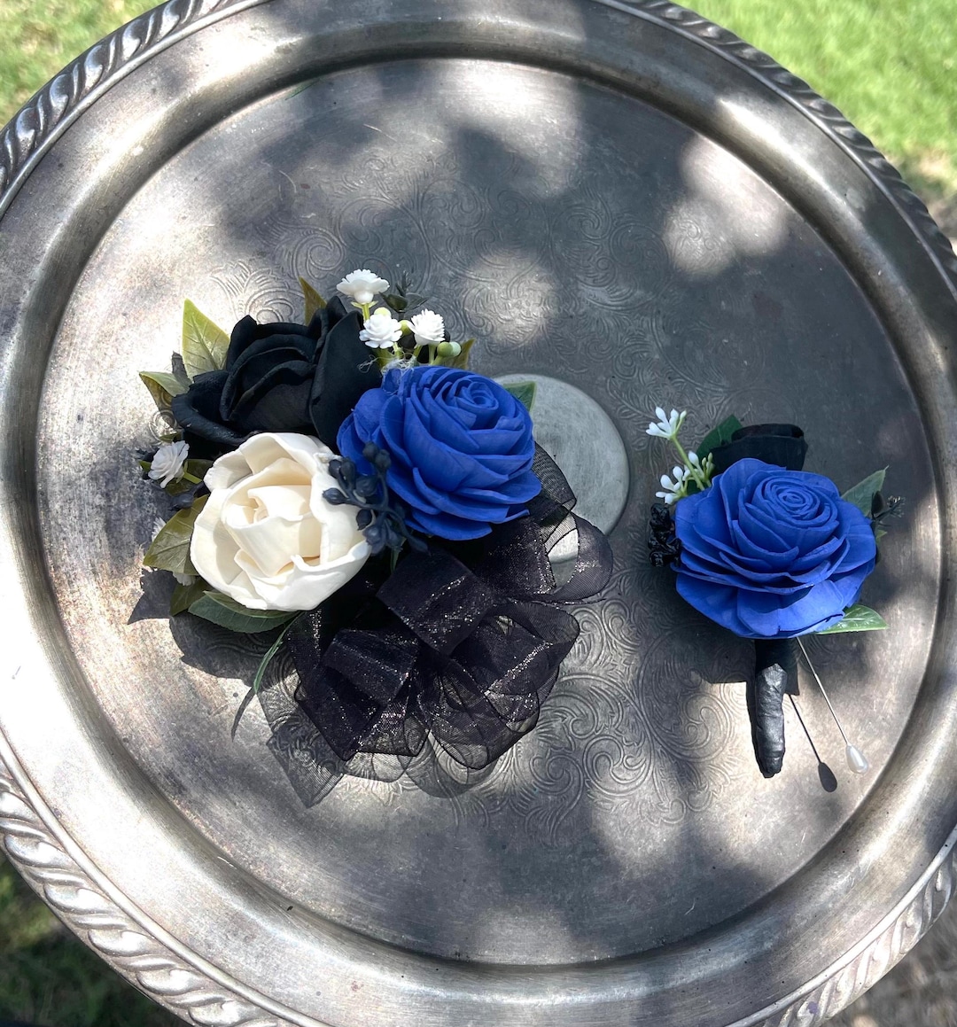 what color corsage for navy blue dress This glamorous corsage of baby white roses will match a navy dress