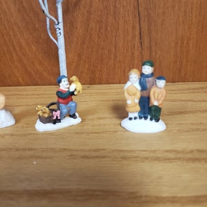 Small Porcelain Christmas Village Figurines Man with dog carolers playing snow