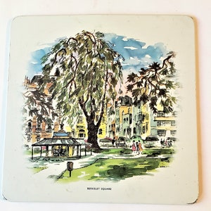 May include: A watercolour painting of Berkeley Square in London, England. The painting shows a park with a large tree in the centre, surrounded by buildings. There are people walking in the park and a small kiosk in the foreground.