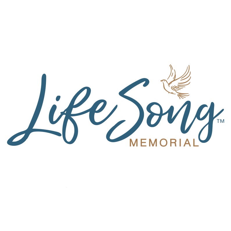 May include: The Life Song Memorial logo features elegant, dark teal script lettering with the words "Life Song" and the word "Memorial" in a smaller, serif font. A gold-colored dove is depicted above the word "Song".