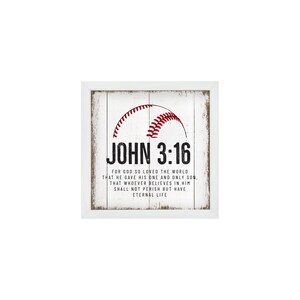May include: White wooden sign with a red and white baseball graphic and the text "JOHN 3:16" in black. The text below the baseball reads "FOR GOD SO LOVED THE WORLD THAT HE GAVE HIS ONE AND ONLY SON, THAT WHOEVER BELIEVES IN HIM SHALL NOT PERISH BUT HAVE ETERNAL LIFE."