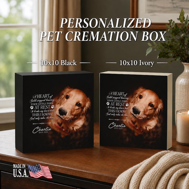 May include: Two square pet cremation boxes, one black and one ivory, each featuring a printed golden retriever portrait and the text: A HEART of Gold stopped beating, FOUR LITTLE PAWS AT REST, It broke my heart but THIS I KNOW God only takes the best, Charlie 2015-2021.