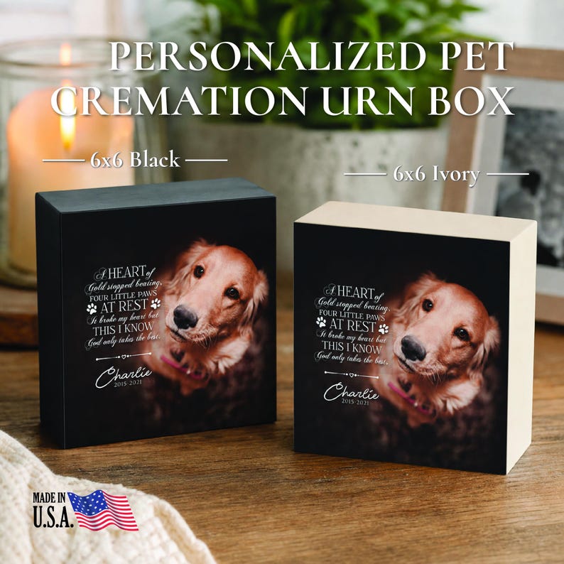 May include: Two square pet cremation urn boxes, one black and one ivory, each featuring a photo of a golden retriever and the text: A HEART of Gold stopped beating, FOUR LITTLE PAWS AT REST, It broke my heart but THIS I KNOW God only takes the best, Charlie 2015-2021.