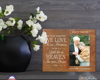 May include: A wooden photo frame with a brown background and a white inscription that reads "Because someone we love is in Heaven, there's a little bit of Heaven in our home". The frame has a photo of an older couple in the center. The inscription at the bottom of the frame reads "Janet Smith June 8, 1936 - August 2, 2015".