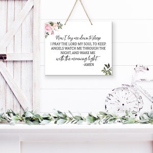 May include: White wooden sign with a floral design and the text "Now I lay me down to sleep I pray the Lord my soul to keep. Angels watch me through the night, and wake me with the morning light. -AMEN"