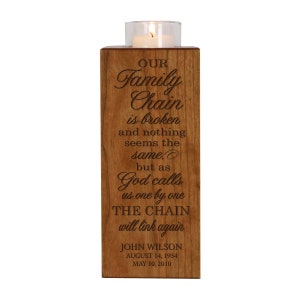 May include: A wooden candle holder with an engraved message that reads "Our Family Chain is broken and nothing seems the same. But as God calls us one by one THE CHAIN will link again." The holder also includes the name "John Wilson" and dates "August 14, 1934" and "May 10, 2010".