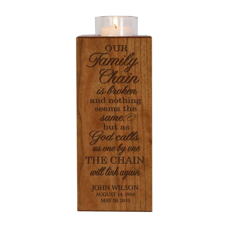 May include: A wooden candle holder with an engraved message that reads "Our Family Chain is broken and nothing seems the same. But as God calls us one by one THE CHAIN will link again." The holder also includes the name "John Wilson" and dates "August 14, 1934" and "May 10, 2010".