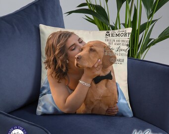 May include: A beige throw pillow with a black and white image of a woman and a dog. The text on the pillow reads "In loving memory unseen and unheard but always near So loved so missed & so very dear Charlie 2000 - 2022".