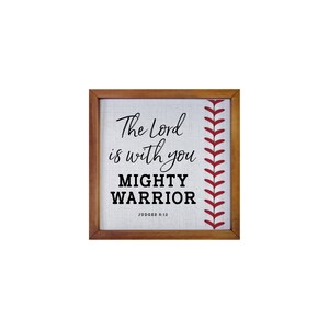 May include: A framed canvas print with a baseball stitch design and the text "The Lord is with you Mighty Warrior Judges 6:12"